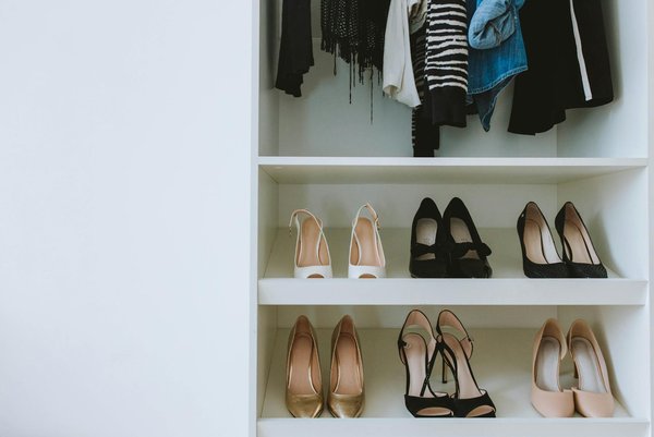 How do you create an efficient and stylish shoe storage system in a narrow UK entryway?